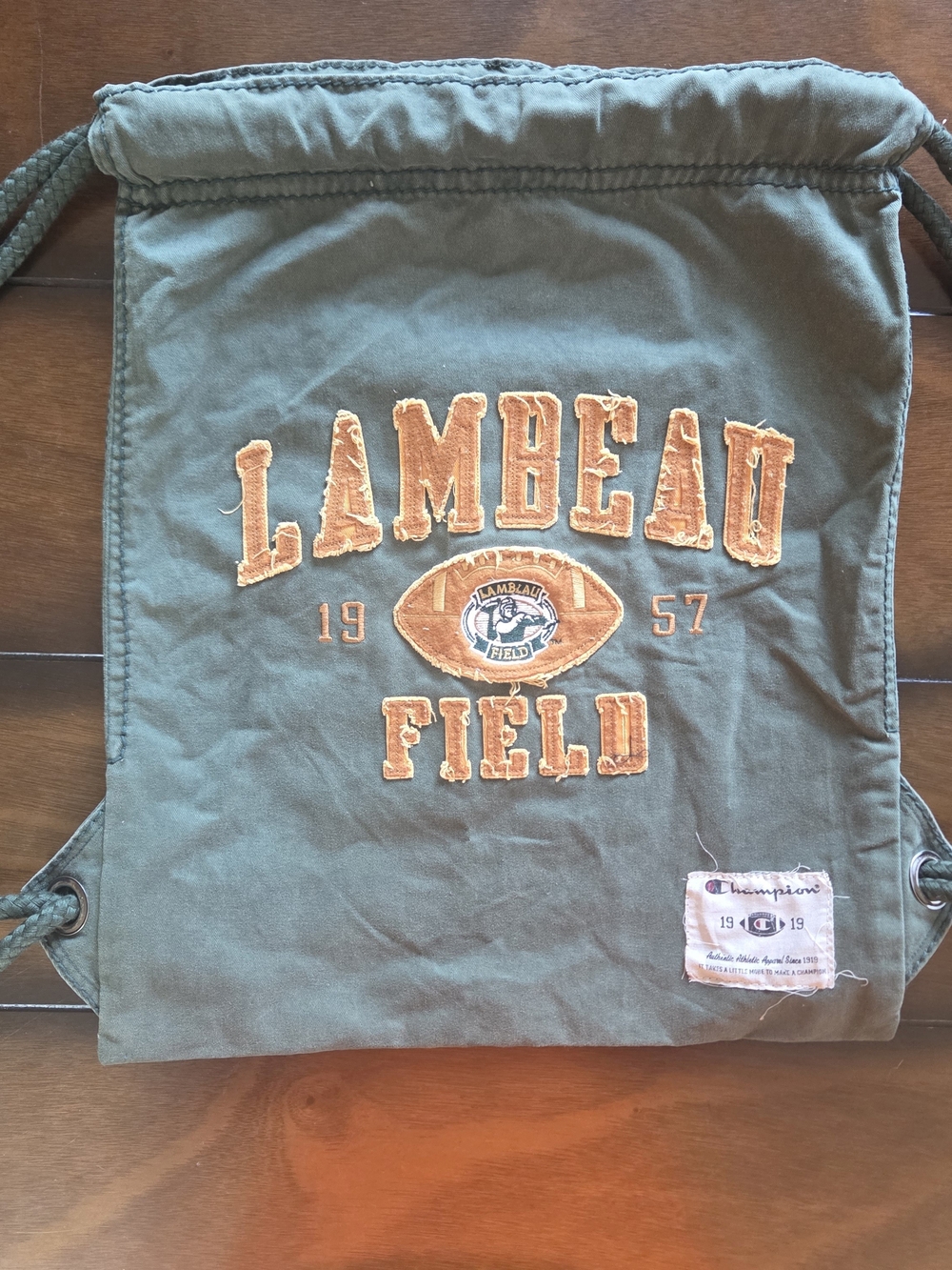 Champion Green Bay drawstring bag features olive green canvas